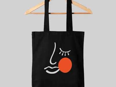Illustrated black tote bag and floral wedding stationery